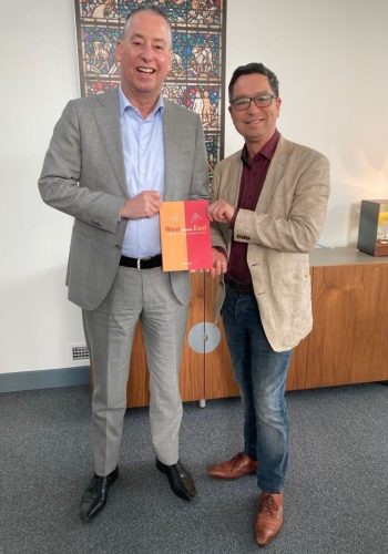 Two men with the book